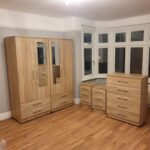 Oak Ready Assembled 4 Door Wardrobe With 2 Mirrors With Chest Drawer and 2 Bedside Cabinets